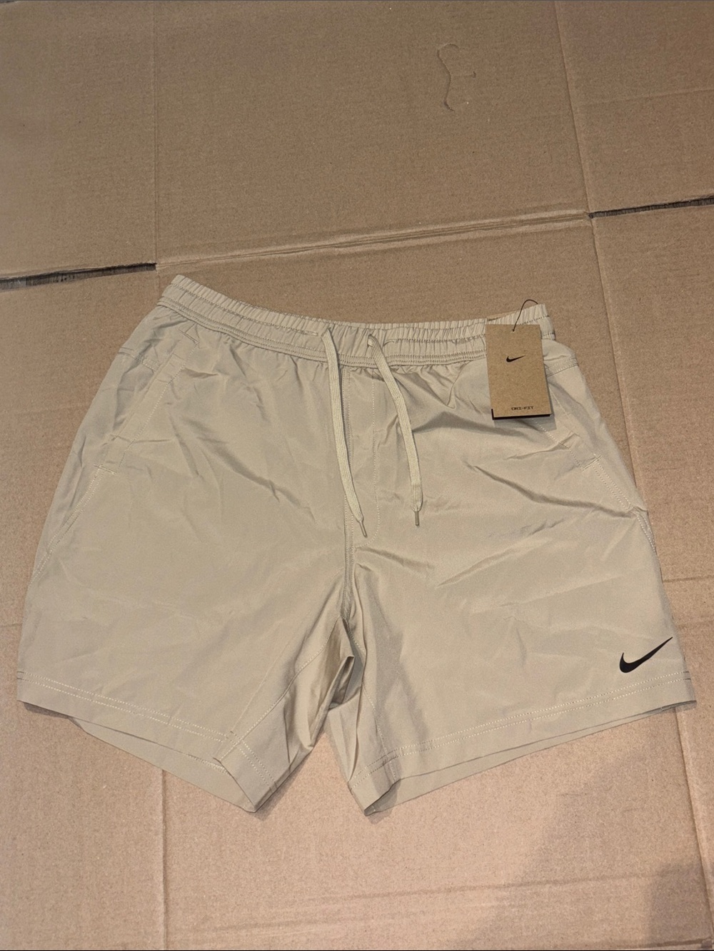 Nike Beige Drawstring Performance Shorts with Black Swoosh